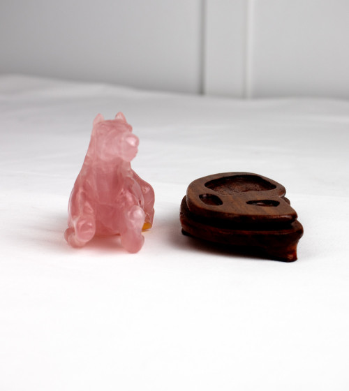 Rose quartz horse on wooden base