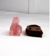 Rose quartz horse on wooden base