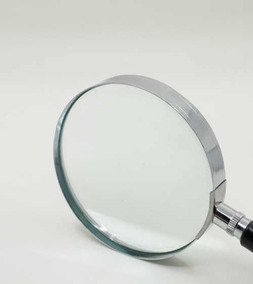 Round magnifying glass with black handle