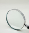 Round magnifying glass with black handle