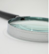 Round magnifying glass with black handle