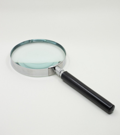 Round magnifying glass with black handle