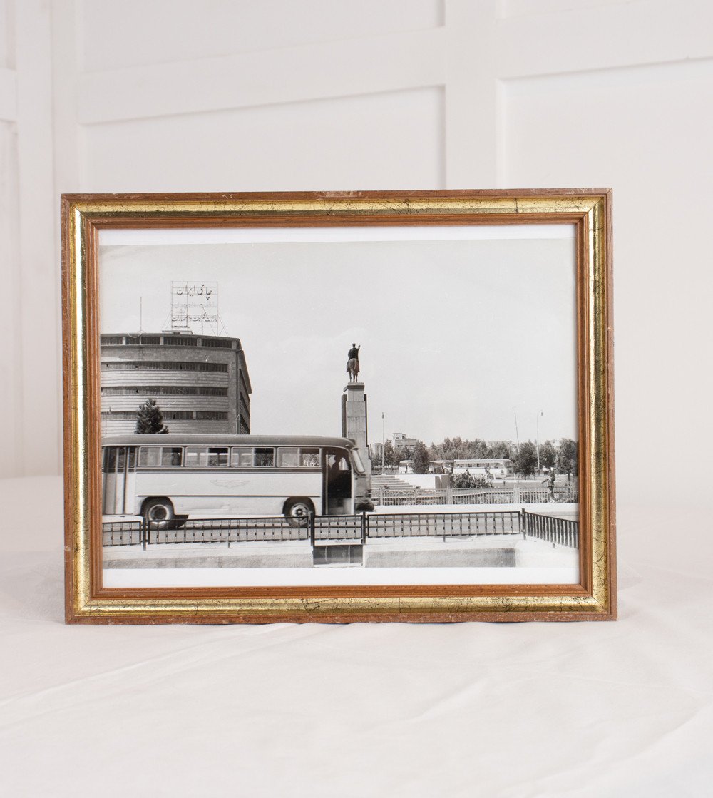 Black and white framed photo with bus