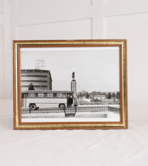 Black and white framed photo with bus